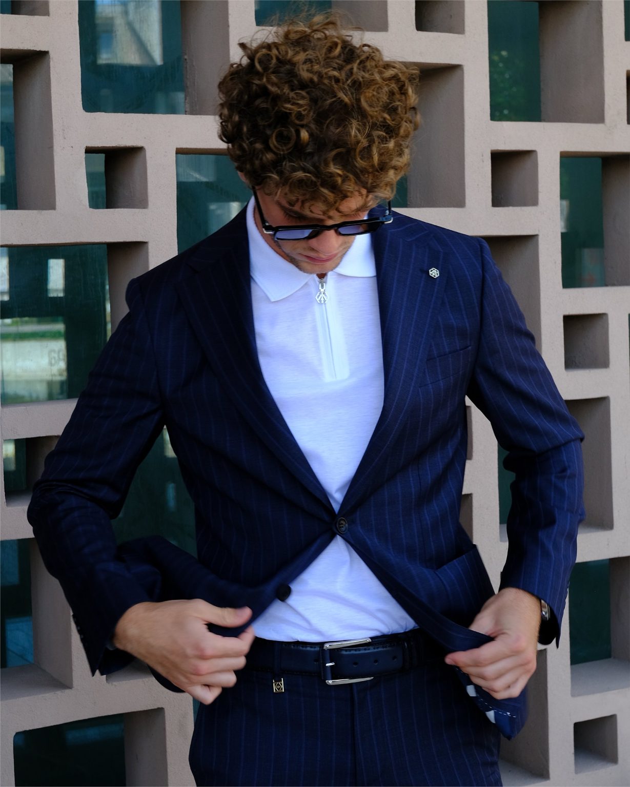 Detail – pinstripe jacket over a zip polo